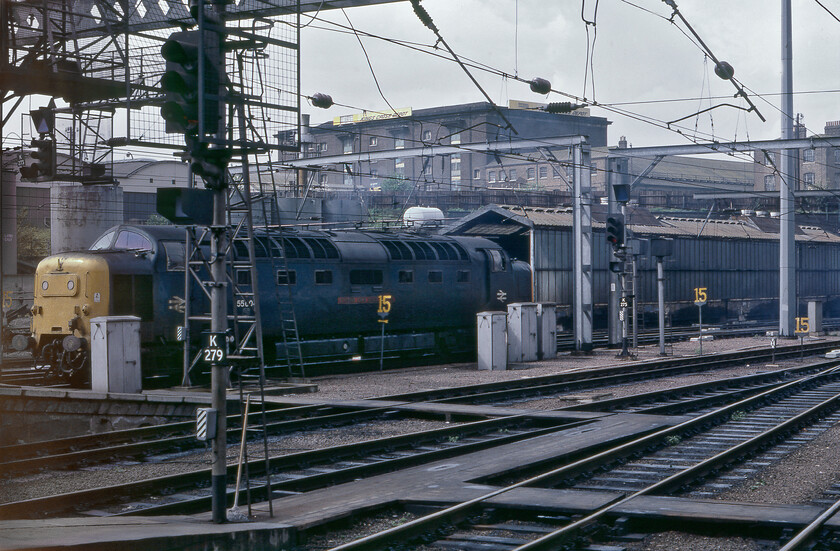 55004, on shed, London Kings Cross station 
 This was an image rescued from the reject box hence its off-centre view and the slight fogging to the left-hand side. However, I have very few images of the King's Cross' maintenance and servicing area especially with a Deltic in full view! It really must have been a filthy and very cramped place to undertake basic servicing on locomotives with them literally flying in and out in between operating ECML express services. In this view, 55004 'Queen's Own Highlander' is just coming off-shed ready to work the 16.05 semi-fast to York. Quite a convoluted set of manoeuvres were required to extricate a locomotive from the rearmost roads of the facility in order to reach the station platforms but it all added more interest to us enthusiasts (I had moved on from being a spotter by this time!). 
 Keywords: 55004 on shed London Kings Cross station Queen's Own Highlander