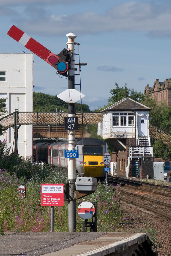 43257, GR 10.00 London King`s Cross-Aberdeen (1S11), Arbroath station 
 A second view of 43257 at the rear of the 10.00 King's Cross to Aberdeen service as it leaves Arbroath station. Whilst the train is partially obscured I was more interested in capturing the box and the signals that it controls. As can be seen in this image, the North British box dating from 1911 cantilevers out over the line with iron supports emanating from a narrow brick base. 
 Keywords: 43257 10.00 London King`s Cross-Aberdeen 1S11 Arbroath station Virgin East Coast HST