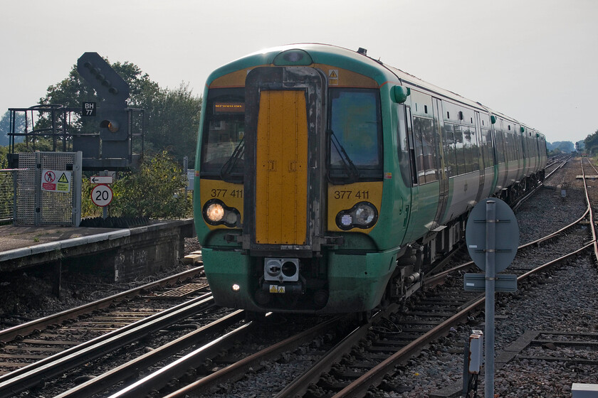 377411, SN 16.33 Portsmouth & Southsea-Brighton (1S29, 10L), Barnham station 
 The first train of my return journey back to Brighton arrives at Barnham station. I took the 1S29 Portsmouth and Southsea to Worthing aboard 377411. Whilst these Electrostars are numerous and a little anonymous their air conditioning was working well on this extremely hot September evening! Apologies for the dreadful head-on lighting but as it was a train that I travelled on it was a requisite that it appear in my records! 
 Keywords: 377411 16.33 Portsmouth & Southsea-Brighton 1S29 Barnham station Southern Electrostar