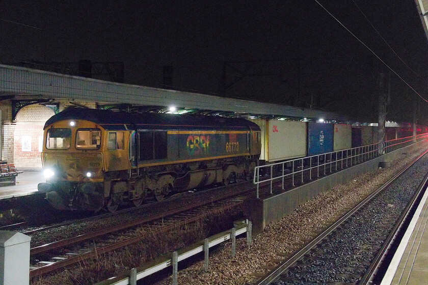 66773, 16.20 Trafford Park-Parkestone SS (4L10, 24L), Nuneaton station 
 66773 'Pride of GB Railfreight' is seen paused at Nuneaton station for a crew change. It is leading the 4L10 16.20 Trafford Park to Parkstone GBRf service which is a freight service that my camera has never captured before. 
 Keywords: 66773 16.20 Trafford Park-Parkestone SS 4L10 Nuneaton station "Pride of GB Railfreight".