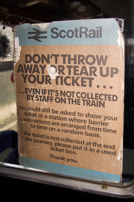 Former ScotRail notice, Mk. II TSO Sc5132, NLR 
 An interesting survivor pictured inside one of the Northampton and Lamport Railway's coaches, Mk. II TSO Sc5132. The notice reveals where it was operating in its final few years but, interestingly after operating on the far north line from Inverness it became part of the Eversholt Train Leasing's portfolio but I am not sure how much, if any, use it saw with them prior to withdrawal in 1999. This particular coach was an early example of the Mk.II with a pair of doors centrally located with this photograph taken in the vestibule of these doors. 
 Keywords: Former ScotRail notice Mk. TSO Sc5132 NLR Northampton and Lamport Railway