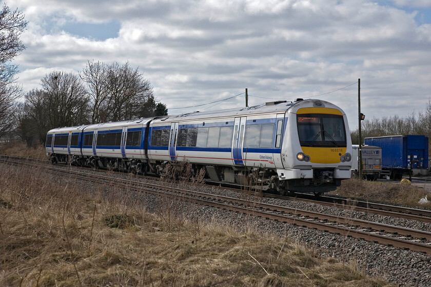 168218, CH 09.09 London Marleybone-Stratford-on-Avon, King's Sutton SP486377 
 Unfortunately, some troublesome cloud has shrouded the sun but, having said that, by this time in the morning this view is becoming a little backlit so perhaps it is a blessing in disguise. 168218 passes just north of King's Sutton working the 09.09 Marylebone to Stratford-on-Avon Chiltern service. No doubt services such as this are conveying many tourists from London to Shakespeer's home town so a regular return direct service pattern is a positive thing but as for the units operating these trains, I am not so sure? 
 Keywords: 168218 09.09 London Marleybone-Stratford-on-Avon King's Sutton SP486377