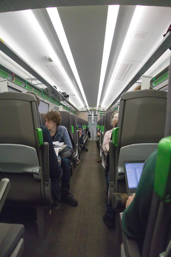 Interior, 800033 
 An interior picture of 800033 whilst it waits at Paddington to depart with the 11.20 to Worcester Foregate Street. This was my first trip on an IET and only for about fifteen minutes as far as Slough. However, here is my initial assessment.........

Positives - Rapid acceleration, very light and airy, plenty of legroom, a generally pleasant ambience.

Negatives - Surprisingly noisy, the ride was choppy, the seats were very hard and unforgiving, maybe too bright, the seating moquette was a bit drab and already showing some signs of wear in places.

An odd observation.....notice that there are printed seat reservations placed in the slots on top of the seatbacks, these as well as the computerised reservations on the displays on the luggage racks! 
 Keywords: Interior 800033