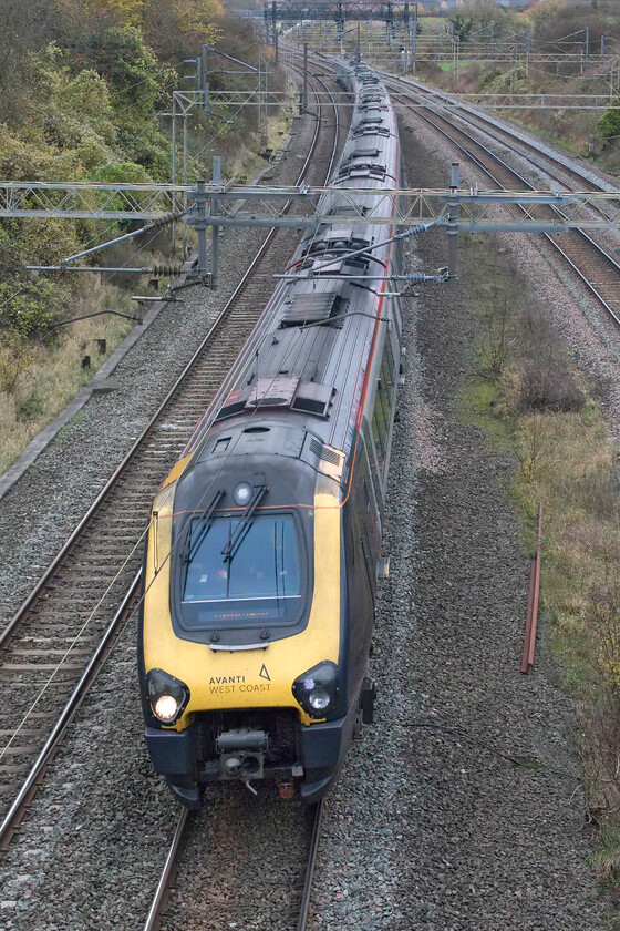 221107 & 221101, VT 08.52 Edinburgh Waverley-London Euston (9M52, 3L), Victoria bridge 
 Love or hate them get your photographs of the Avanti West Coast Voyagers in whilst you can! They will not be around for very much longer on this route with the arrival of the new bi-mode units being constructed at the moment. 221107 and 221101 pass Victoria bridge working the 9M52 08.52 Edinburgh to Euston service. Hopefully, the new trains will bring an end to a crazy situation such as this, namely, a pair of fuel-hungry diesel units running for four hundred miles entirely under fully energized 25kV wiring! 
 Keywords: 221107 221101 08.52 Edinburgh Waverley-London Euston 9M52 Victoria bridge Avanti West Coast Voyager