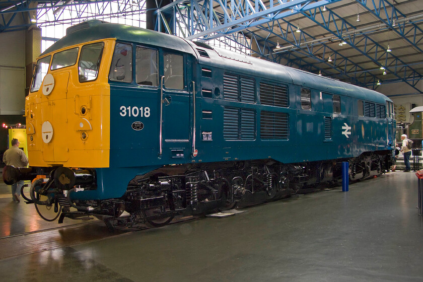 31018, preserved, NRM 
 As D5500 the TOPS numbered 31018 was the first built example of one of British Railways' more successful first-generation diesel designs that is after the entire class was re-engined from 1964! The early class members were delivered with marker disks rather than having a headcode panel and were dubbed skinheads. Back in 1978 I photographed it working on the North Yorkshire Moors Railway two years after BR had withdrawn it from service in July 1976, see....... https://www.ontheupfast.com/p/21936chg/25492182204/d5500-freight-goathland-station 
 Keywords: 31018 preserved NRM National Railway Museum