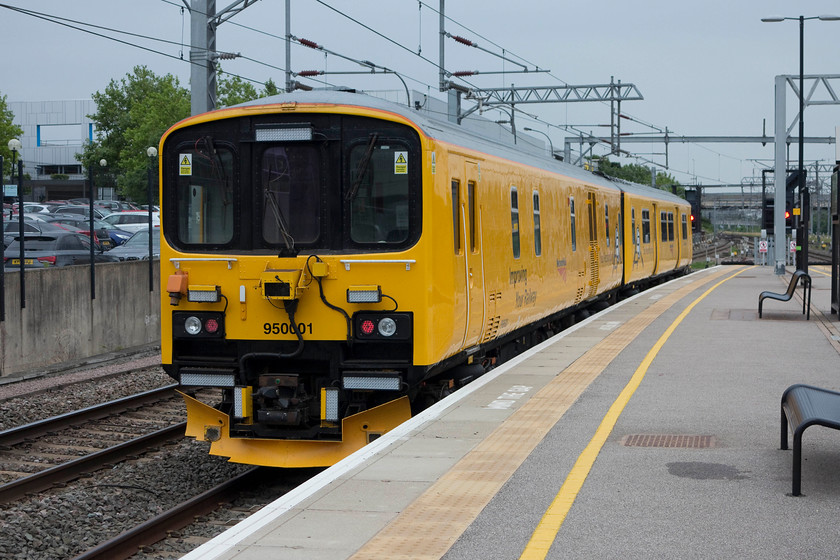 950001, 09.44 Tring-Derby RTC (via MKC reverse), Milton Keynes station 
 Network Rail's track assessment unit, 950001, pauses at Milton Keynes. It is more unusual to find it on the WCML as it usually works on the secondary lines where the normal NMT HST is not suitable. On this day, the unit was working the 09.44 Tring to Derby RTC via a reversal at Milton Keynes. 
 Keywords: 950001 09.44 Tring-Derby RTC Milton Keynes station