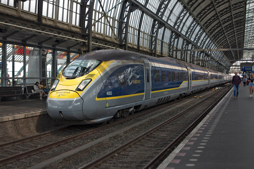 374002, 16.48 Amsterdam Central-Brussels Midi (Eurostar 9177), Amsterdam Central station 
 These class 374 Eurostars are so long that they occupy about 3/4 of the length of Amsterdam Central's extra long platforms. As can be seen here, they extend a considerable distance over the crossovers (under the fourth carriage back) that mark the half way point of the platforms. 374002 waits to leave Central station with the 16.48 to Brussels Midi. 
 Keywords: 375002 16.48 Amsterdam Central-Brussels Midi Eurostar 9177 Amsterdam Central station