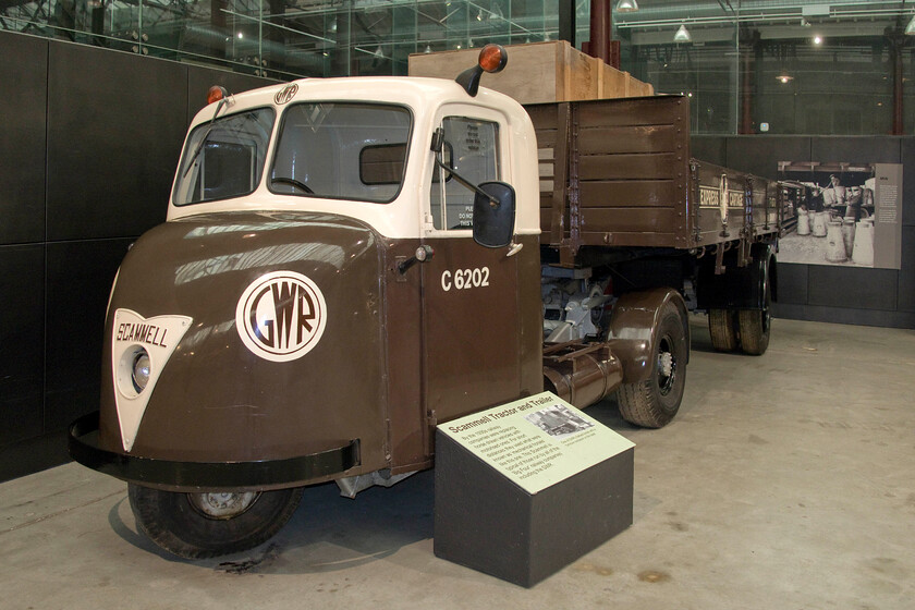 Scammell Scarab tractor & trailer, on display, Steam museum, Swindon 
 A fine example of Scammell Scarab tractor and trailer inside Swindon's Steam museum. Thousands of these versatile three-wheeler units were built between 1948 and 1967 with the railways being the recipients of many including, as is the case here, the GWR. However, this example is not quite authentic as this particular model was not introduced until post-nationalisation with the GWR operating Scammell Mechanical Horses that were a considerably older design. 
 Keywords: Scammell tractor & trailer on display Steam museum Swindon Scarab