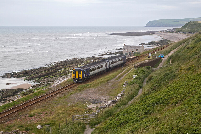 156482, NT 13.07 Carlisle-Lancaster (2C54, RT), Nethertown 
 156482 travels along the Cumbrian Coast working the 13.07 Carlisle to Lancaster service past Nethertown station. This view clearly shows the remote nature of this station with St. Bees head prominent in the background. Notice my car, the sole occupier of the station 'car park'! 
 Keywords: 156482, NT 13.07 Carlisle-Lancaster (2C54, RT), Nethertown.