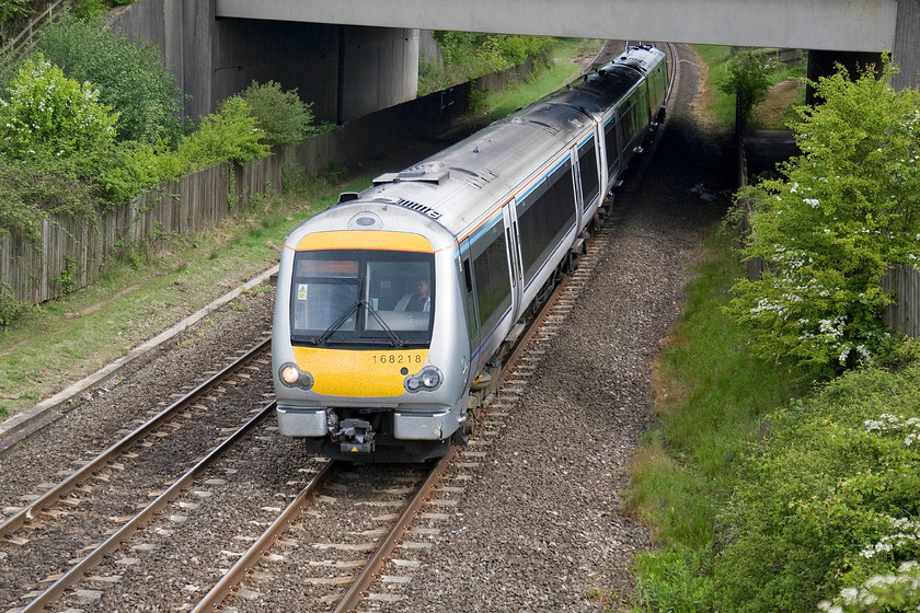 168218, CH 09.14 Stratford-on-Avon-London Marylebone (1H37), Hardwick-Farm-bridge SP463429 
 168218 comes under the slab of concrete that is the M40 overbridge just north of Banbury. It is forming the 09.14 Stratford-on-Avon to London Marylebone Chiltern service, next stop, in about a mile and a half, will be Banbury. 
 Keywords: 168218, CH 09.14 Stratford-on-Avon-London Marylebone (1H37), Hardwick-Farm-bridge SP463429 Chiltern Railways Turbo