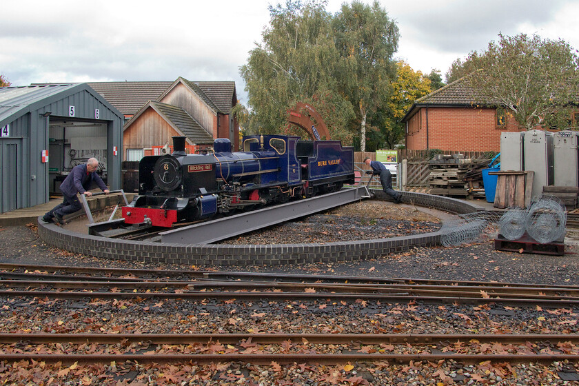 6, being turned, Aylsham (Bure Valley Railway) station 
 6 'Blickling Hall' is seen on 20th October 2022 being turned on Aylsham's turntable made easier by two staff putting their back into it! Number 6 was built by Winson Engineering at their Penrhyndeudraeth workshop in 1994. Inspired by the Indian Railway 'ZB' class the locomotive has been in regular use on the BVR ever since having undergone two overhauls since its introduction. With various modifications, it is now the line's most efficient tender locomotive. 
 Keywords: 6 being turned, Aylsham Bure Valley Railway station Blickling Hall