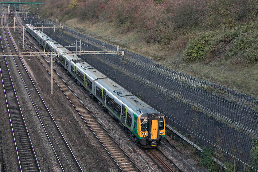 350108 & 350114, LN 13.14 Birmingham New Street-London Euston (2Y28, RT), Roade Cutting 
 With just a hint of afternoon light reflected in its windscreen, 350108 leads 350114 through Roade Cutting. It is working the Sunday 2Y28 Birmingham New Street to Euston service. 
 Keywords: 350108 350114 13.14 Birmingham New Street-London Euston 2Y28 Roade Cutting