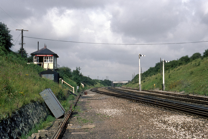 Desborough North signal box (Mid, c.1895) 
 Desborough North signal box occupied a commanding position half way up on an embankment north of the closed station. In this view, the down relief line is seen adjacent to the main lines. I know very little about this 1895 Midland box, if anybody can furnish me with some facts I would appreciate it. 
 Keywords: Desborough North signal box Midland Railway