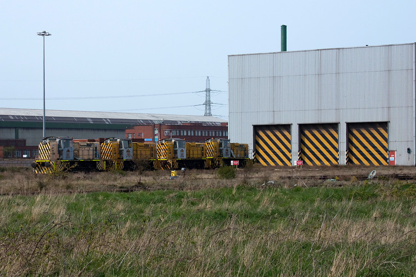 260, 269, 257 & 265, stored, Redcar steelworks 
 A line up of mothballed English Electric Stephenson four-axle shunters are seen outside the maintenance shed at the former Redcar steelworks. Numbers 260, 269, 257 and 265 are just four of the remaining shunters that were mothballed in 2010. These shunters were rated at 750bhp and used for moving the steel torpedo wagons around the complex. With the complete closure of the plant in October 2015, their future is uncertain, many having already left the site. 
 Keywords: 260, 269, 257 & 265 Redcar steelworks