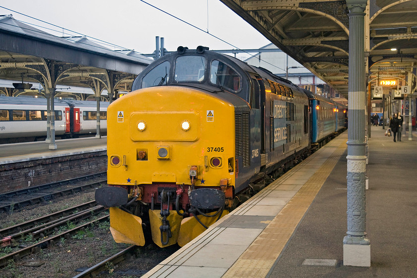 37405, LE 17.36 Norwich-Great Yarmouth (2P32), Norwich station 
 37405 will work the 17.36 evening commuter service from Norwich to Great Yarmouth. Out of sight on the rear is 37425 'Sir Robert McAlpine'. The Mk. II stock brings a welcome boost to capacity for the travellers heading back to the coast as well as a considerable improvement in comfort! 
 Keywords: 37405 17.36 Norwich-Great Yarmouth 2P32 Norwich station DRS Direct Rail Services GA Greater Anglia