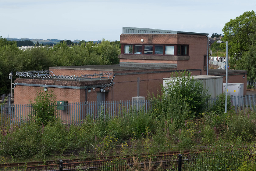 Kilmarnock signal box (BR, 1976) 
 Kilmarnock signal box is a relatively modern and not particularly attractive structure built by BR in 1966. It is situated in the apex of the junction between the Glasgow route and the line to Brassie Junction. It controls this junction and also the exit/entry into the Wabtec Rail Scotland facility. 
 Keywords: Kilmarnock signal box