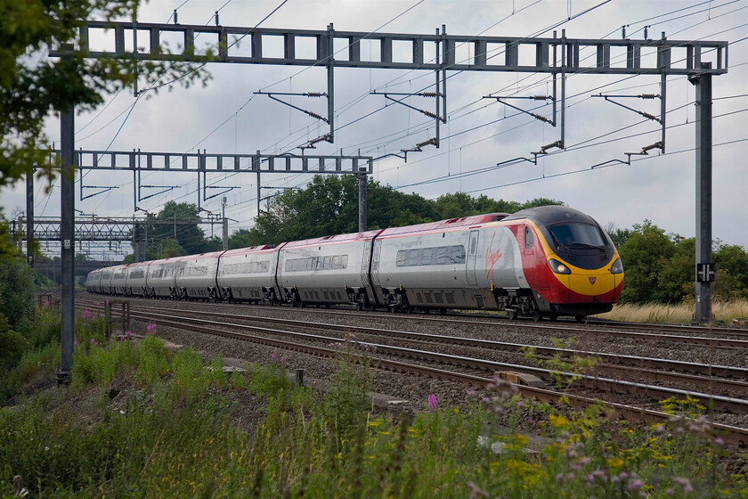 390141, VT 07.30 London Euston-Glasgow Central, between Roade & Ashton 
 Virgin's 390141 passes between Roade and Ashton working the first down Anglo-Scottish express of the day, the 07.30 Euston to Glasgow Central. 
 Keywords: 390141 07.30 London Euston-Glasgow Central between Roade & Ashton Virgin Pendolino