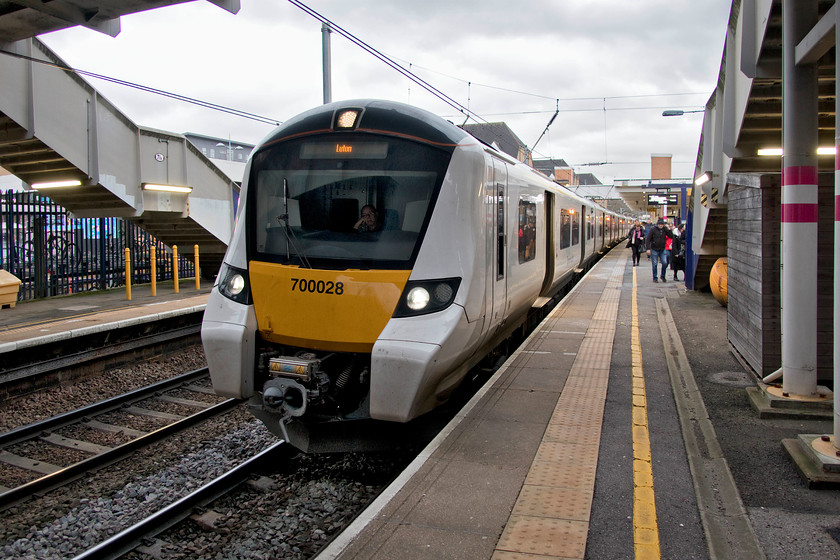 700028, TL 14.58 Rainham-Luton (9P42, RT), Elstree & Borehamwood station 
 In the gathering gloom at Elstree and Borehamwood station, 700028 pauses with the 14.58 Rainham to Luton cross-London working. My wife and I took this train from Kentish Town. Notice the driver's nonchalant approach to doing his job in the cab - not quite like when a 4MT would have operated a similar service some sixty years ago! 
 Keywords: 700028 14.58 Rainham-Luton 9P42 Elstree & Borehamwood station Thameslink