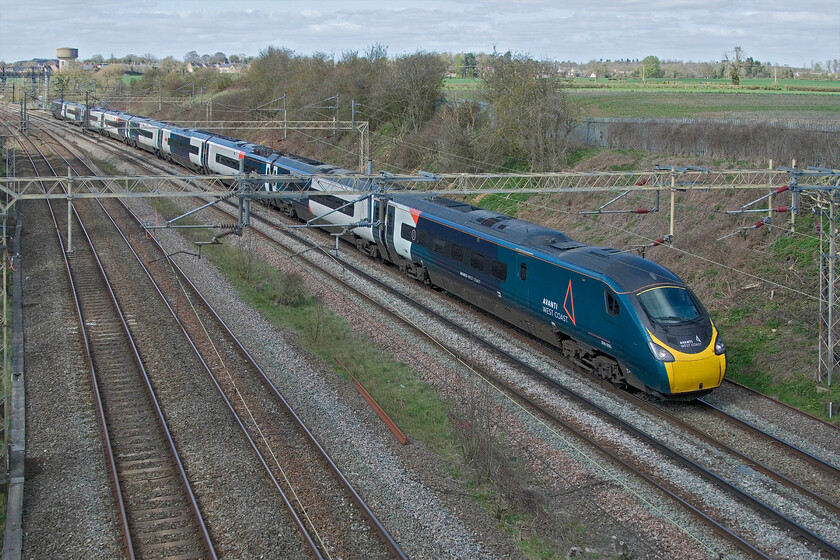 390005, VT 11.47 Preston-London Euston (1M11, 13E), Victoria bridge 
 Eagle-eyed visitors will notice that Pendolino 390005 is running on the up slow line at Victoria bridge just north of Hanslope Junction. With the Weedon route closed for engineering works all traffic was being diverted via Northampton with adjusted timings to suit. The 1M11 11.47 Preston to Euston arrived fairly early at its destination with the generous retiming taking care of the re-routing. 
 Keywords: 390005 11.47 Preston-London Euston 1M11 Victoria bridge AWC Avanti West Coast Pendolino