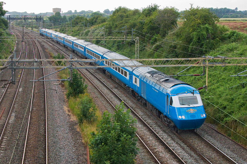 W43059, return leg of The North Wales Coastal Pullman, 16.00 Llandudno-Basingstoke, (1Z46, RT), Victoria bridge 
 The reproduction Blue Pullman HST is in popular demand for railtours all over the network offering a nostalgic combination of service and quality. Having missed the outward working in the morning I managed to get out and capture the returning North Wales Coastal Pullman charter passing Victoria bridge just south of Roade in Northamptonshire. With W43059 leading the 16.00 Llandudno to Basingstoke, running as 1Z46, certainly brightens up a rather dull early July evening. 
 Keywords: W43059 The North Wales Coastal Pullman 16.00 Llandudno-Basingstoke 1Z46 Victoria bridge HST Blue Pullman Statesman Rail