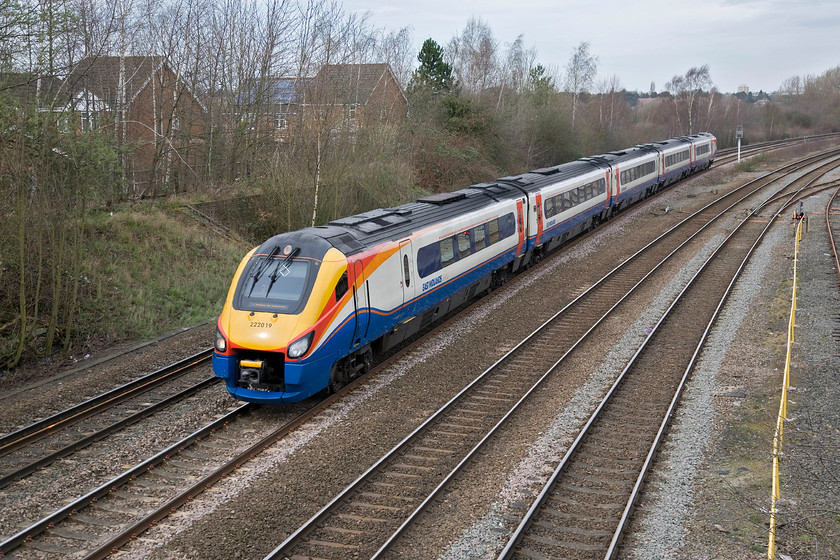 222019, EM 11.05 Nottingham-London St. Pancras (1B36), Kettering Broadway SP864771 
 With the weak sun just being reflected on the nose of 222019 it is seen just south of Kettering station from the Broadway footbridge. The Meridian is working the 1B36 11.05 Nottingham to London St. Pancras service. Notice the brick revetment behind the front carriage of the train cut into the embankment. It looks as if once housed a signal box but I do not believe there was one at the south end of the yard intermediate to Kettering Station and Kettering Junction boxes with the latter about one mile south from this location....that is unless local knowledge tells me otherwise! 
 Keywords: 222019 11.05 Nottingham-London St. Pancras 1B36 Kettering Broadway SP864771 East Midlands Trains Meridian