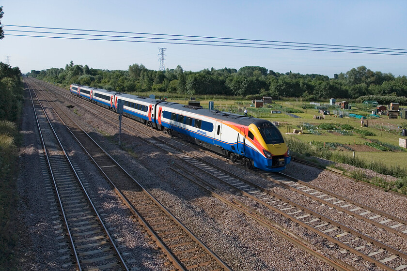 222014, EM 07.55 London St. Pancras-Sheffield (1F10), Lower Farm Road, Bromham TL028518 
 Some allotment holders can be seen busy at work on their plots in the warm July sunshine in this wide-angled view at Bromham in Bedfordshire. Meanwhile, 222014 passes heading north working the 07.55 St. Pancras to Sheffield service. 
 Keywords: 222014 07.55 London St. Pancras-Sheffield 1F10 Lower Farm Road Bromham TL028518 EMT East Midlands Trains Merdian