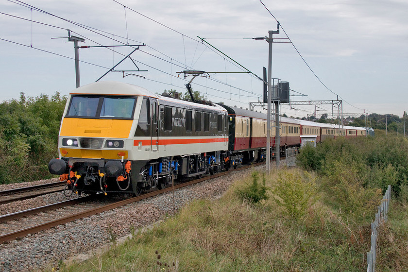 90001 & 40145, 13.11 London Euston-Crewe HS (5Z46, 20E), Wilson's Crossing 
 What a smashing sight! Evoking memories of the late 1980s and early 1990s 90001 'Royal Scot' leads a train past Wilson's Crossing near Northampton in its authentic InterCity swallow livery. Now operated by Locomotives Services Limited (LSL) from their Crewe facility the 90 was leading the returning stock from a four-day railtour around Scotland. Leaving Euston at 13.11 and running as 5Z56 it arrived back at Crewe well ahead of schedule. At the rear of the train is 40145 that was also used on the railtour and led the train up the WCML on the previous Friday taking the stock to London. Unfortunately, I was not able to witness that particular event as I was in Nottingham on that day! 
 Keywords: 90001 40145 13.11 London Euston-Crewe HS 5Z46 Wilson's Crossing Royal Scot