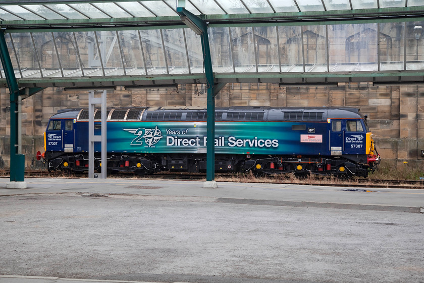 57307, stabled Thunderbird, Carlisle station 
 57307 'Lady Penelope' stands at Carlisle awaiting 'the call'! As one of the DRS Thunderbirds it sits until called upon to rescue a failed Pendolino or Voyager. This is a task that it and the others do not have to undertake very often. 57307 was new to Cardiff Canton as D1901 in September 1965. Under TOPS it became 47225 and spent many years as a Railfreight locomotive then becoming a Freightliner machine. It was rebuilt into 57307 in 2003. 
 Keywords: 57307 Thunderbird Carlisle station