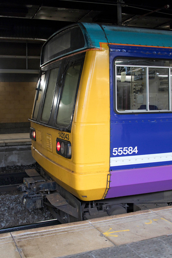 143043, NT 16.37 Manchester Victoria-Wigan Wallgate (2F80, 2L), Manchester Victoria station 
 The driver has yet to take his seat in what will become the leading cab of 143043 at Manchester Victoria station. This Pacer will soon form the 16.37 to Wigan Wallgate, a seventeen-mile journey that takes just under an hour. These un-loved units have been part of the railways in the north-west for over thirty years now but things are about to change as complete withdrawal beckons in next two months. 
 Keywords: 143043 16.37 Manchester Victoria-Wigan Wallgate 2F80 Manchester Victoria station