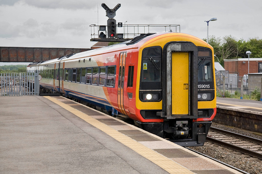 159015, SW 15.51 Bristol Temple Meads-London Waterloo (1O60), Westbury station 
 South West Trains' 159015 arrives at Westbury station working the 15.51 Bristol Temple Meads to Waterloo service. This is an odd working that takes a convoluted route from Bristol via the Avon Valley to Salisbury then north-east to London. However, I would accept this journey in this type of unit as the 159s are basically a scratch Mk.III with a Cummins 400 hp diesel under the body meaning that they are relatively quick, ride well and are comfortable. 
 Keywords: 159015 15.51 Bristol Temple Meads-London Waterloo 1O60 Westbury station