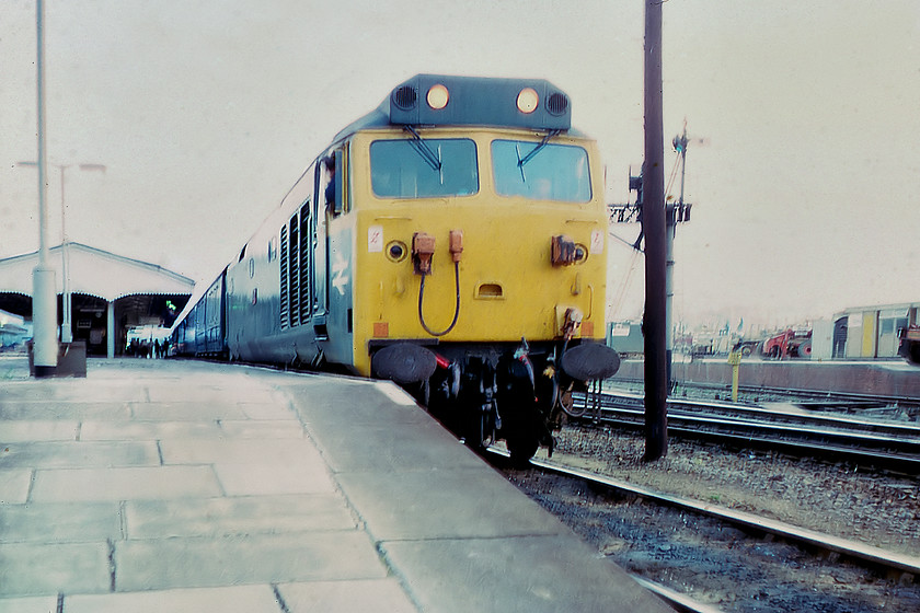 50027, 16.23 Penzance-London Paddington, Westbury station 
 This was a photograph that was discovered in the rejects' box for obvious reasons! In fact, I almost did not bother with it as the image was so poor! However, I gave it my best shot and have managed a half reasonable presentation depicting 50027 'Lion' in almost darkness at Westbury station leading the 16.23 Penzance to Paddington. We had just alighted from this train having enjoyed haulage all the way from Newton Abbot. 
 Keywords: 50027 16.23 Penzance-London Paddington Westbury station