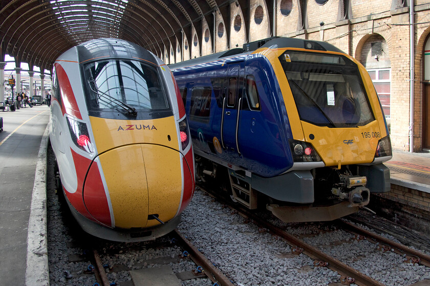 801216 GR 09.59 Peterborough-York (1N81, RT) & 195008, NT 12.10 York-Blackpool North Carr MPD (3Z21, 1L), York station 
 The new faces of York station! We had just arrived aboard 801216 that had terminated as the 1N81 09.59 from Kings Cross. This was my first trip on an Azuma finding it a fast accelerating train but with the much-criticised hard seating spoiling the ride. To the right of the Azuma is a Northern Civity number 195008 that will work the 12.10 service to Blackpool North that, interestingly is actually scheduled to terminate at the town's North Carr depot after a reversal at the station. 
 Keywords: 801216 09.59 Peterborough-York 1N81 195008 12.10 York-Blackpool North Carr MPD 3Z21 York station LNER Azuma Northern CAF Civity